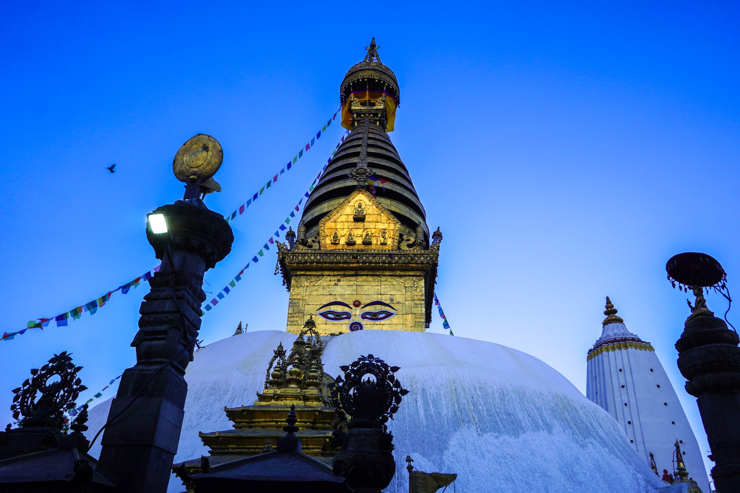 Swyambhunath Views: Capturing Peace Above the Valley 22 Golden hour view of Swayambhunath Stupa with Kathmandu Valley in the background.