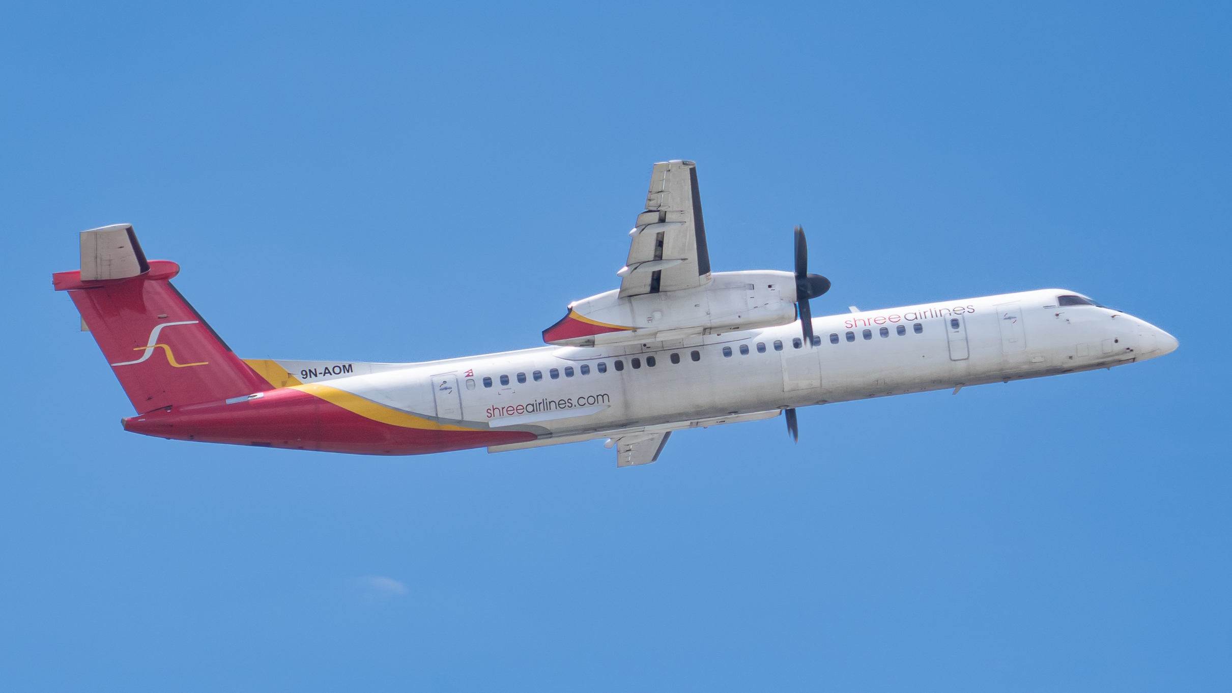 Bombardier DHC-8-400 with registration 9N-AOM